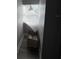 Small storage area with a window covered by a damaged shade at 309 Old Mission Rd, New Smyrna Beach, FL 32168