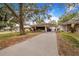 Charming single story home with front yard, driveway, and carport at 3215 Roscoe Ave, Lakeland, FL 33803