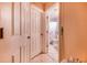 Hallway view of bathroom featuring tile floors and shower at 3215 Roscoe Ave, Lakeland, FL 33803