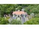 Aerial view of the gated community entrance with manicured landscaping and water fountain at 3623 Eversholt St, Clermont, FL 34711