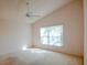 Bright bedroom featuring a large window and neutral carpet at 3623 Eversholt St, Clermont, FL 34711