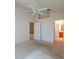 Bright bedroom featuring high ceilings and a ceiling fan for added comfort at 3623 Eversholt St, Clermont, FL 34711