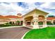 Elegant clubhouse entrance with a covered portico and manicured landscaping at 3623 Eversholt St, Clermont, FL 34711