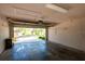 Spacious garage with high ceilings and plenty of room for parking and storage at 3623 Eversholt St, Clermont, FL 34711