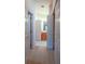 Hallway view showcasing access to bathroom and closet at 3623 Eversholt St, Clermont, FL 34711
