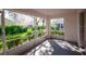 Enclosed patio overlooking meticulously maintained green spaces and lush perimeter landscaping at 3623 Eversholt St, Clermont, FL 34711
