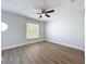 Bedroom featuring hardwood floors and natural light at 3654 Peppervine Dr, Orlando, FL 32828