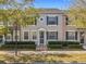 Charming townhome exterior featuring neat landscaping and well-maintained facade at 3654 Peppervine Dr, Orlando, FL 32828