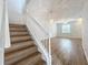 Bright staircase leading to a spacious living area with modern lighting and wood floors at 3654 Peppervine Dr, Orlando, FL 32828