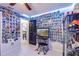 Interesting bedroom with a ceiling fan and walls covered in Hot Wheels toy car packaging at 402 Bramble Way, Minneola, FL 34715