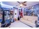 Fun bedroom design with creative decor, collectible display, and comfortable seating at 402 Bramble Way, Minneola, FL 34715