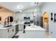 Bright kitchen with modern appliances, white cabinets, and island, offering a clean, updated space at 402 Bramble Way, Minneola, FL 34715