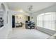 Open-concept living area with arched doorways, ample workspace, and lots of natural light at 402 Bramble Way, Minneola, FL 34715