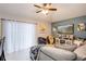 Bright and airy living room with large windows, modern decor, and comfortable seating at 402 Bramble Way, Minneola, FL 34715