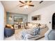 Comfortable living room featuring a cozy sofa, entertainment center, and stylish decor at 402 Bramble Way, Minneola, FL 34715