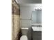Bathroom featuring a vanity with drawers, toilet and patterned shower curtain at 5112 Conroy Rd # 17, Orlando, FL 32811