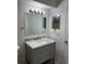 Bathroom featuring a vanity with drawers and a large mirror at 5112 Conroy Rd # 17, Orlando, FL 32811