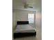 Simple bedroom with a bed, ceiling fan and window with blind at 5112 Conroy Rd # 17, Orlando, FL 32811