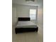 Simple bedroom with a bed, ceiling fan and window with blind at 5112 Conroy Rd # 17, Orlando, FL 32811