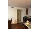 A dining room featuring hard wood floors and access to a hallway for easy navigation throughout the home at 5112 Conroy Rd # 17, Orlando, FL 32811