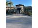 Luxurious home showcasing beautiful stonework, a circular entryway, and lush landscaping at 5112 Conroy Rd # 17, Orlando, FL 32811