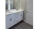 Bathroom vanity features double sinks, white cabinets, and a white countertop at 620 N 2Nd N St, Lake Hamilton, FL 33851