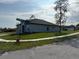 Corner lot home with a well-maintained lawn and view of neighborhood street at 620 N 2Nd N St, Lake Hamilton, FL 33851