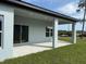 A spacious covered outdoor patio with recessed lighting, perfect for relaxing and enjoying the outdoors at 620 N 2Nd N St, Lake Hamilton, FL 33851