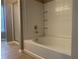 Bathroom featuring a soaking tub and tiled shower at 7117 Red Lantern Dr # 7117, Harmony, FL 34773
