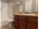 Bathroom with vanity, mirror, toilet, and tub/shower combination at 7117 Red Lantern Dr # 7117, Harmony, FL 34773