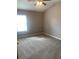 Bright bedroom with neutral walls, carpet flooring and a window at 7117 Red Lantern Dr # 7117, Harmony, FL 34773
