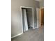 Bedroom closet with rods and carpet flooring at 7117 Red Lantern Dr # 7117, Harmony, FL 34773