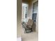 Comfortable outdoor seating area on the porch, perfect for relaxing at 7117 Red Lantern Dr # 7117, Harmony, FL 34773