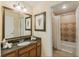 Inviting bathroom with granite countertops and separate shower at 7697 Heritage Crossing Way # 302, Reunion, FL 34747