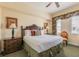 Inviting bedroom featuring a large bed, dresser, and natural light at 7697 Heritage Crossing Way # 302, Reunion, FL 34747