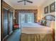 Comfortable bedroom with French doors, a king bed, and neutral tones, perfect for relaxation at 7697 Heritage Crossing Way # 302, Reunion, FL 34747