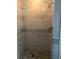 Contemporary shower featuring pebble flooring and marble-style tiled walls at 7697 Heritage Crossing Way # 302, Reunion, FL 34747