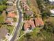 This is an aerial view showing the neighborhood with beautiful landscaping and elegant homes at 800 Stephens Pass Cv, Lake Mary, FL 32746