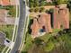 Aerial view of a Mediterranean-style home with a tile roof, pool, patio and meticulously kept yard at 800 Stephens Pass Cv, Lake Mary, FL 32746