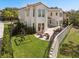 The backyard features a play area, a patio with a fire pit, and views of the manicured lawn at 800 Stephens Pass Cv, Lake Mary, FL 32746