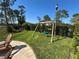 Backyard lawn with tire swing and seating area at 800 Stephens Pass Cv, Lake Mary, FL 32746