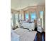 Charming bedroom featuring lake view, natural light, and a cozy daybed with plush cushions at 800 Stephens Pass Cv, Lake Mary, FL 32746