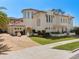 Stunning Mediterranean-style home featuring a tile roof, circular tower, and lush landscaping at 800 Stephens Pass Cv, Lake Mary, FL 32746