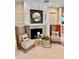 Living room with fireplace and decorative details, featuring zebra print chairs at 800 Stephens Pass Cv, Lake Mary, FL 32746