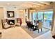 Open concept design with dining area, living room, fireplace, and access to the pool at 800 Stephens Pass Cv, Lake Mary, FL 32746