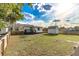 Spacious backyard with a shed is enclosed by a wooden privacy fence at 906 Se 3Rd St, Mulberry, FL 33860