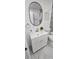 Charming bathroom with a modern sink, fixtures, a sleek toilet, and marble look flooring at 906 Se 3Rd St, Mulberry, FL 33860