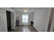 Bright bedroom featuring wood-look floors, a ceiling fan, and a closet with double doors at 906 Se 3Rd St, Mulberry, FL 33860
