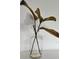 Close-up of clear glass vase with faux magnolia and brown leaves adding elegance to any room at 906 Se 3Rd St, Mulberry, FL 33860