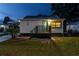 Charming home with a covered porch, well-maintained lawn, and landscaped front yard, perfect for curb appeal at 906 Se 3Rd St, Mulberry, FL 33860